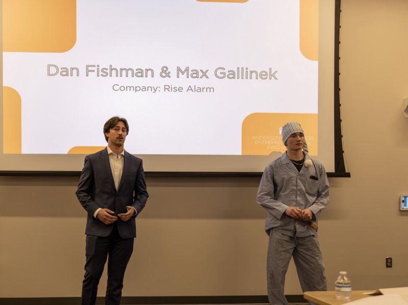 Max Gallinek in pajamas and a nightcap pitching Rise Alarm with co-founder Dan Fishman