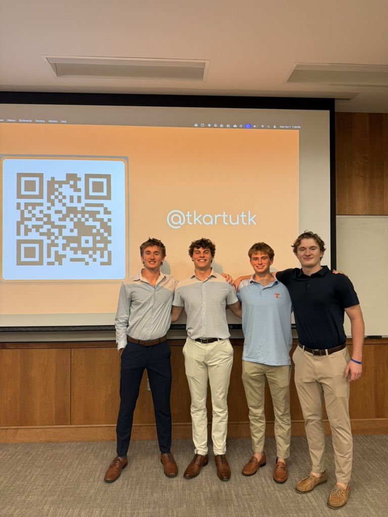 The T-Karts founders standing in front of their @tkartutk slide